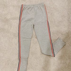 gray leggings with stripes along the side